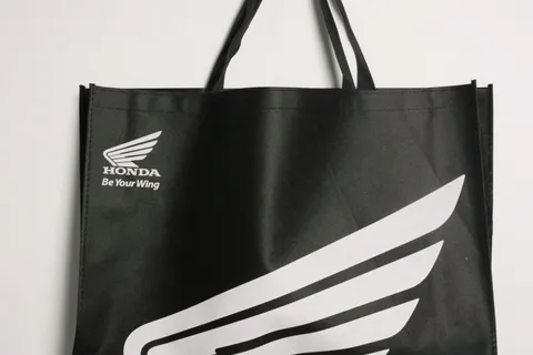 Automotive brand — Black non-woven tote, white print